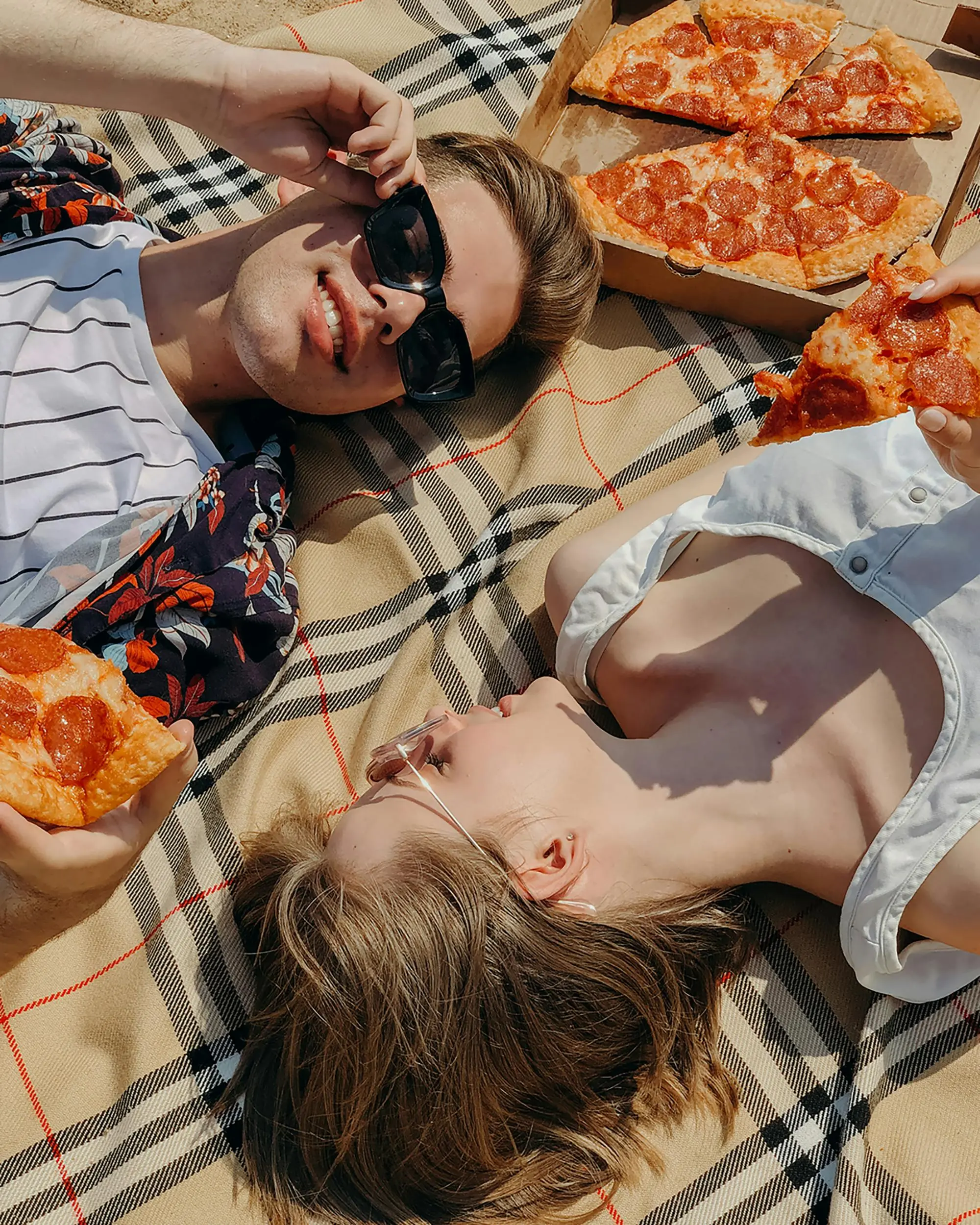 Friends sharing pizza at a table
