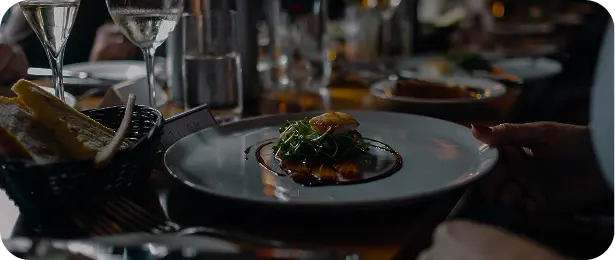 Restaurant kitchen with served dishes and glasses on the table
