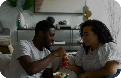 Friends taking photos and laughing over lunch