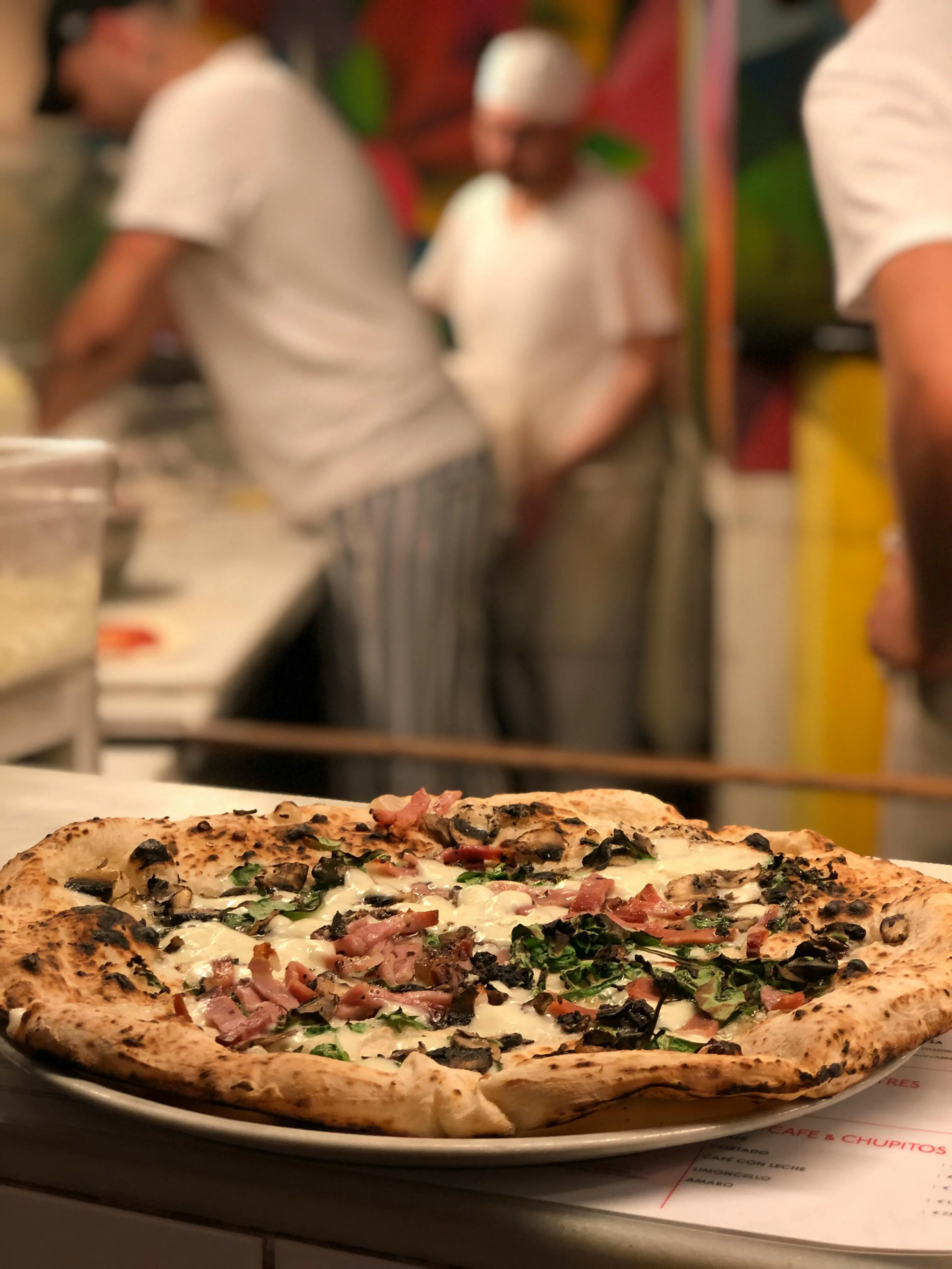Inside view of a lively pizzeria
